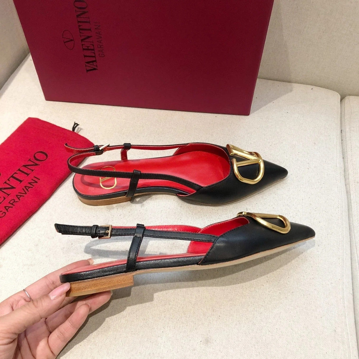 VLOGO SIGNATURE BLACK CALFSKIN FLAT SLINGBACK PUMP WITH GOLD LOGO