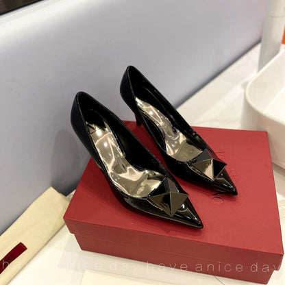 One Stud Black Patent Black Leather Pump